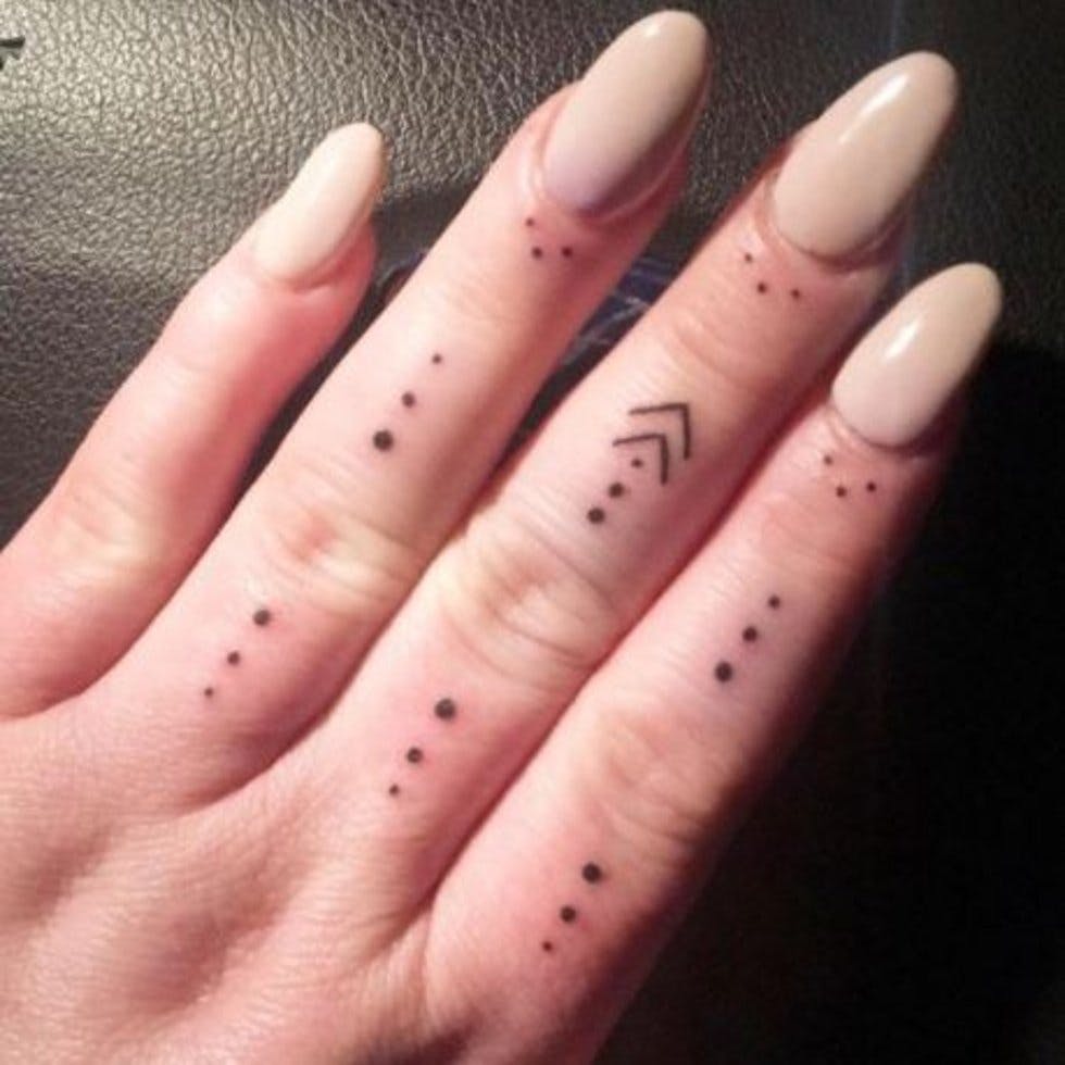 30 intricate and tiny cuticle tattoos to inspire your next inking