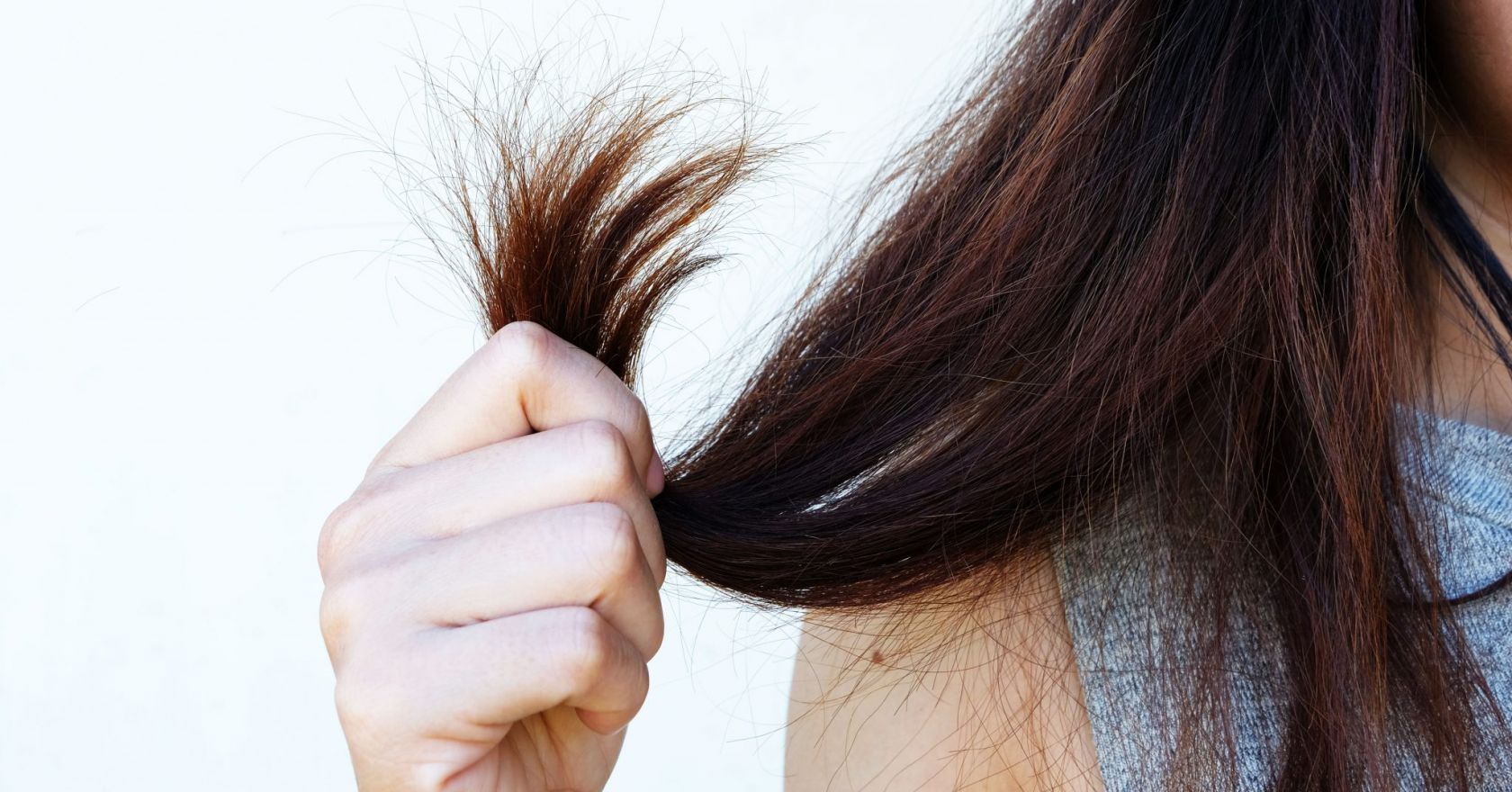 spraying perfume on scalp